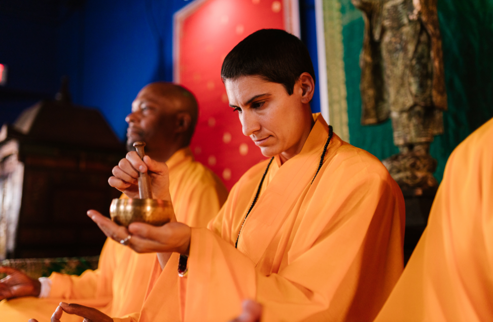 tibetan monk with tibetan bowl